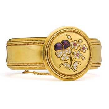 Gold bangle with amethyst, ruby, and diamond flower.