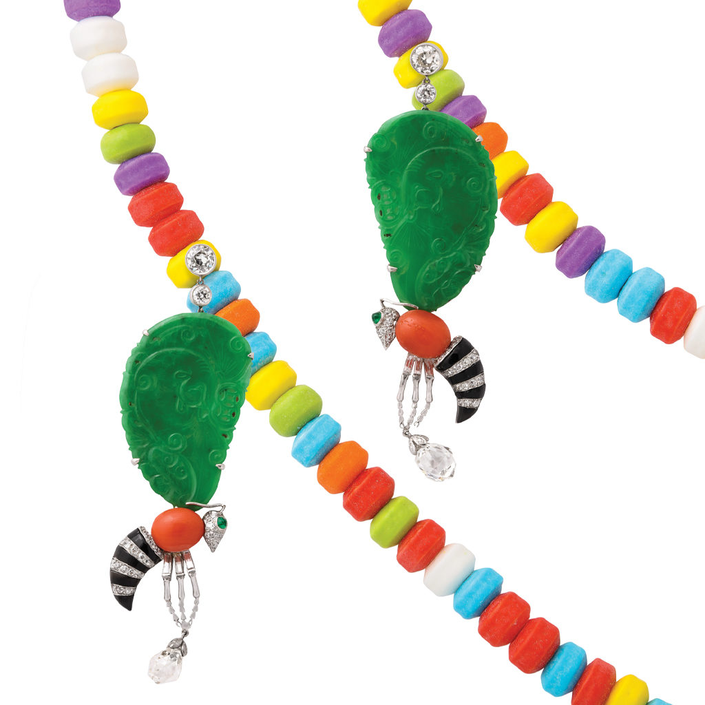 Contemporary jade wasp earrings hanging from candy necklace
