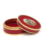 Circular red lacquer and purpurine box set with micromosaic in center. Shown here open. 