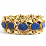 Main view of 18k gold bracelet set with oval lapis panels