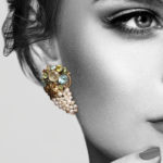 Model wearing seed pearl and multigem earrings by Dorrie Nossiter