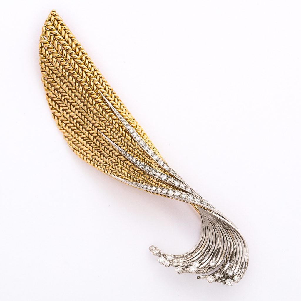 main view, platinum, gold, and diamond feather brooch by Pierre Sterle featured in JCK article