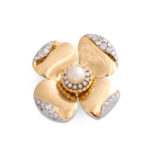 gold flower head brooch consisting of four petals, each with diamonds at the tip. With a diamond and cultured pearl cluster in the center.