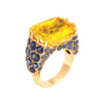 main view of Vintage Cartier yellow sapphire ring set in gold with blue sapphires