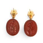 back view of carnelian scarab earrings showing engraved designs - one of a man with a sword, the other of a man with a bow
