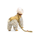 Back view of antique gold and pearl poodle pendant