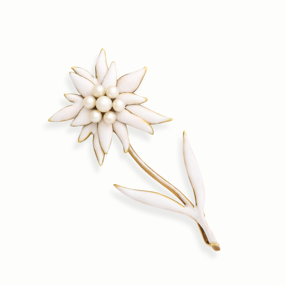 flower brooch designed as an Edelweiss flower with gold, white opaque enamel, and a cluster of natural pearls at the center