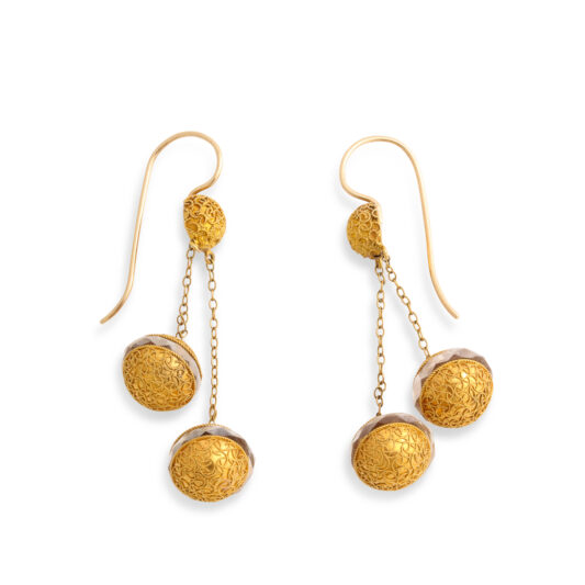 side view of gold ball double pendant earrings