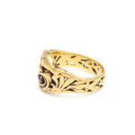 side view of gold and ruby gargoyle ring