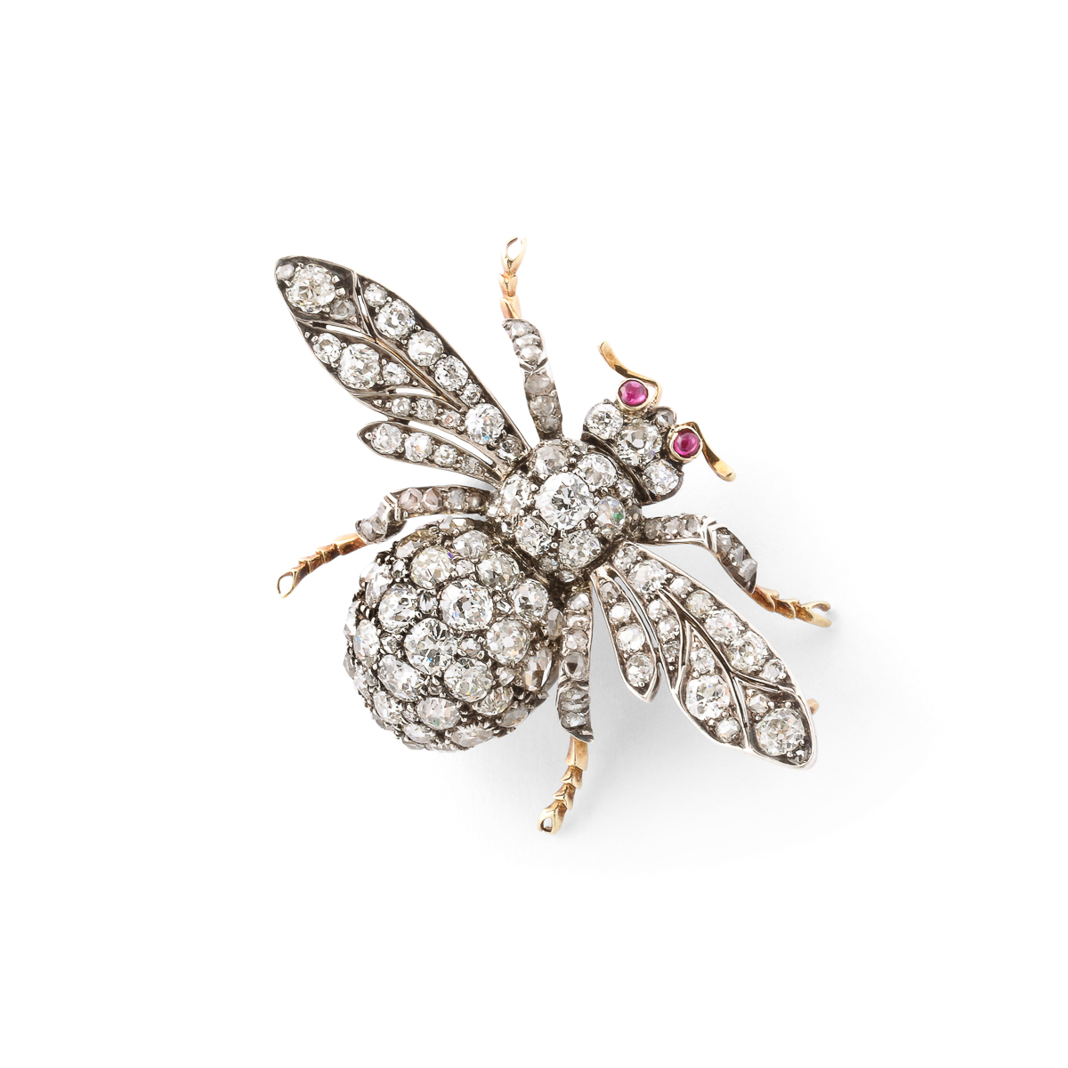 angled view of diamond bumble bee brooch with ruby eyes