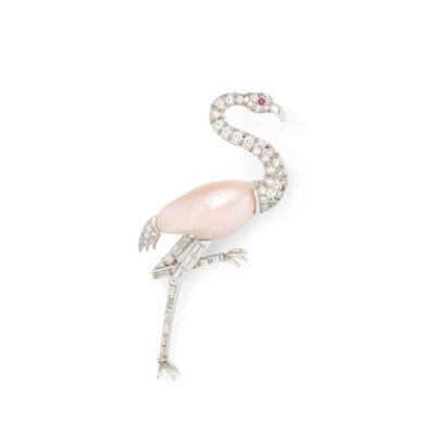 Flamingo brooch with Mississippi river pearl body and diamond limbs, neck, and tail. The head set with a ruby eye.