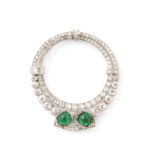 brilliant and baguette-cut diamond circular clip brooch set with two cabochon emeralds