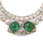 detail view of diamond and emerald circle brooch