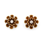 top view of gold flower earrings set with diamonds