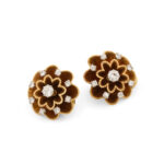 another view of gold flower earrings set with diamonds