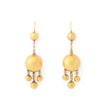 gold ball pendant earrings composed of one large gold ball suspending three smaller gold balls