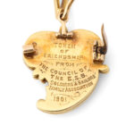 back of twisted heart pendant illustration the inscription "Token of friendship from the Council of the E. S. B. Soldiers' & Sailors' Family Association, 1901"