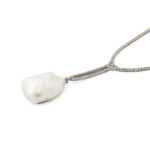 side view of diamond necklace with blister pearl pendant
