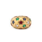 top view of gold bombe ring set with emeralds, sapphires, rubies, and diamonds