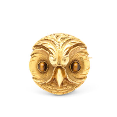 gold owl head brooch set with cabochon tiger eyes