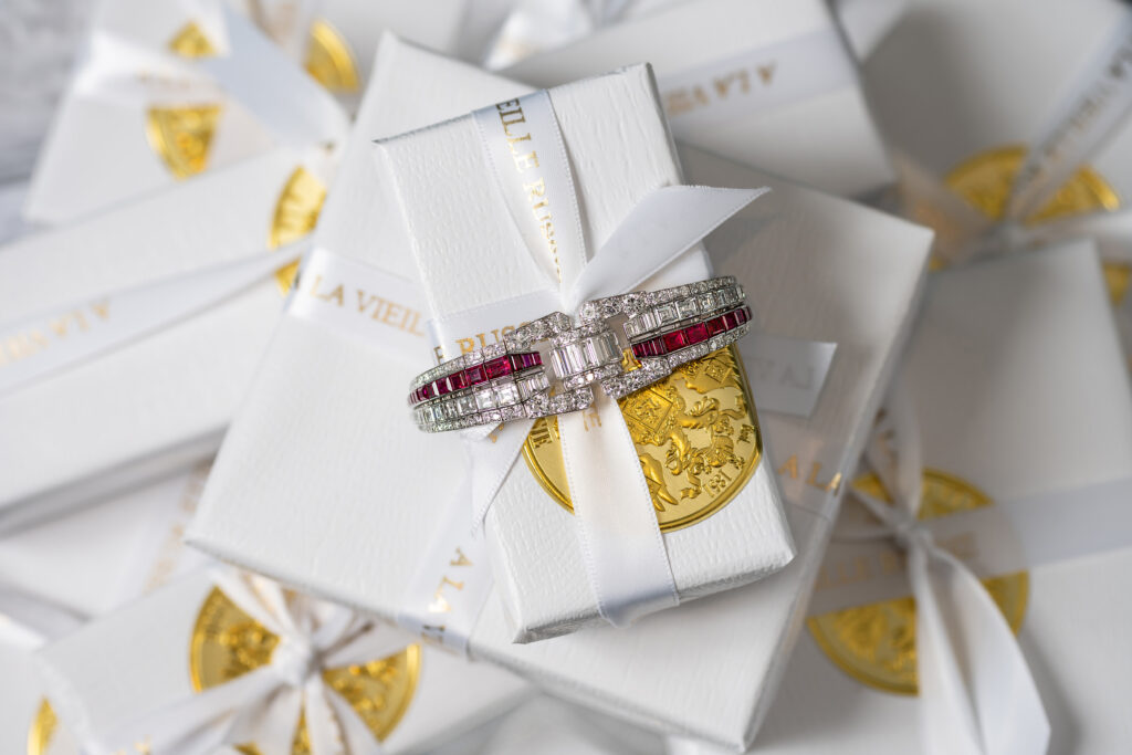 diamond and ruby bracelet on a pile of presents