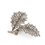 side angled view of diamond brooch depicting two leaves