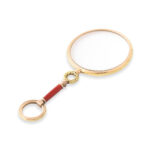 another view of gold magnifying glass with red enamel handle