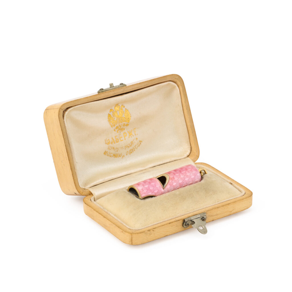 pink enamel whistle in a Faberge fitted box